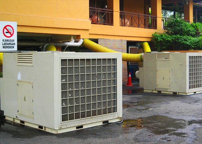 A display of TK Rentals’ 23HP 36HP Air-Cooled Self-Contained air cond rental units in an outdoor setting.