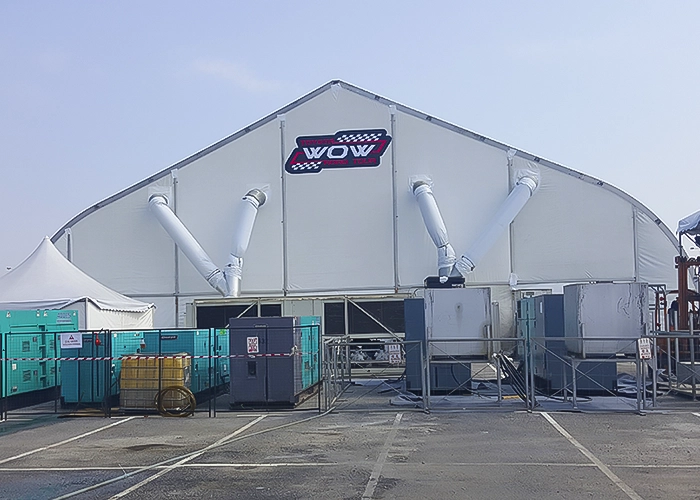 A frontal shot of an ATS Tent rental unit in an outdoor setting.