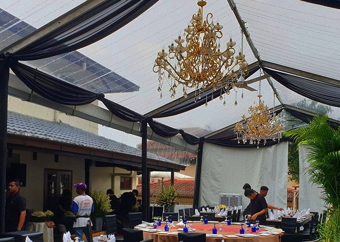 TK Rentals’ Chandelier Light & Tent Scallop equipment rental in display.