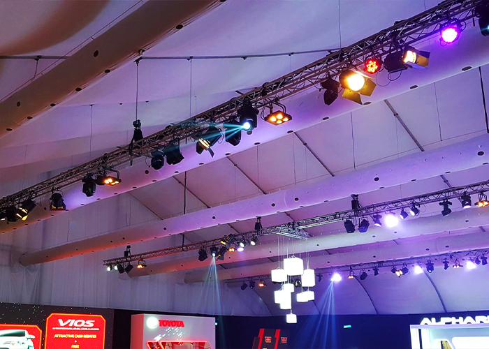 A display of TK Rentals’ Fabric Ducting Air Cond rental system units in an indoor setting.