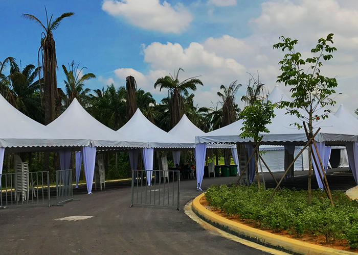 A display of TK Rentals’ gazebo tent rental units in an outdoor setting next to each other.