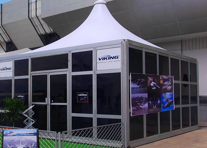 A display of TK Rentals’ modular tent rental unit system in an outdoor setting.