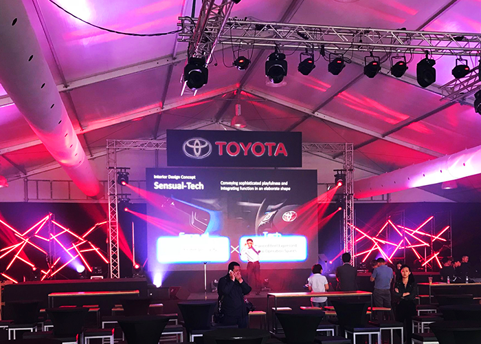 TK Rentals’ Marquee Tent rental on display for an event, housing multiple furniture and equipment within.
