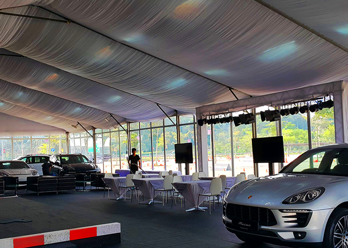 The interior view of TK Rental’s tent rental display setup for the Porsche event.